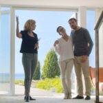 Real estate agent showing clients around