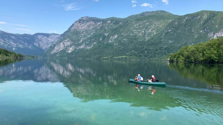 Couple canoeing on a Slovenian Lake