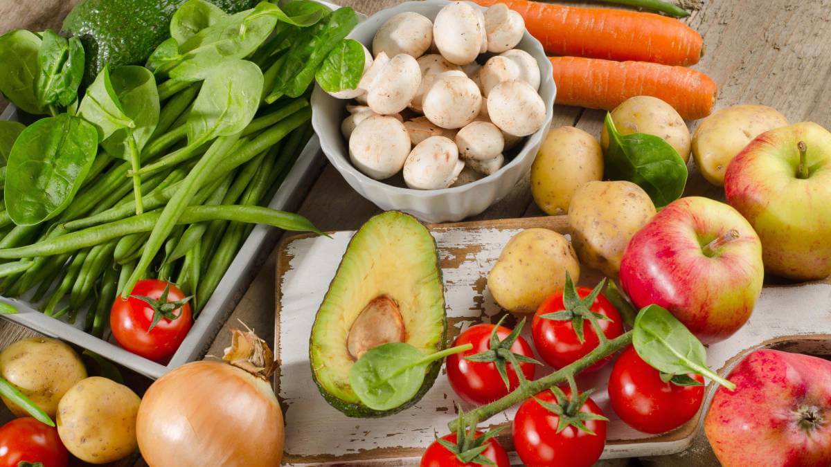 A platter full of fresh fruit and vegetables