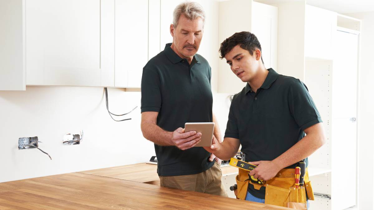 Man getting advice from a carpenter