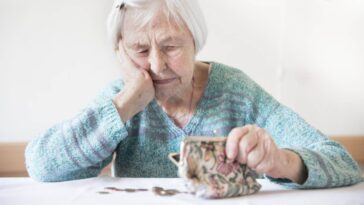 Old woman counting her money
