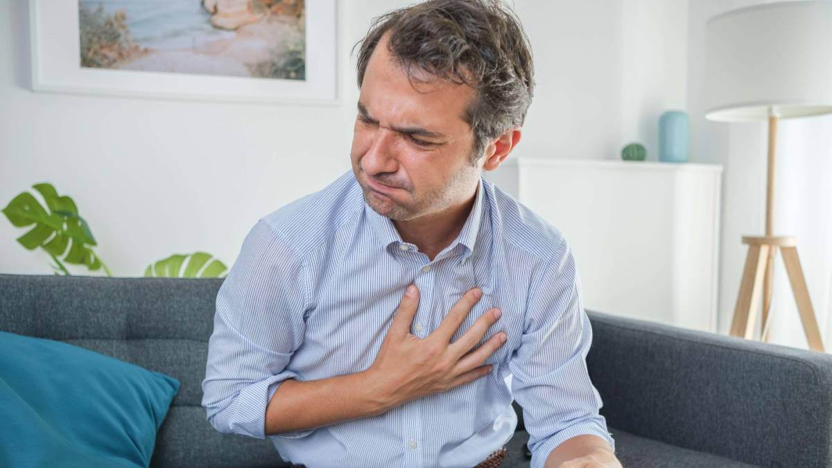 man finding it difficult to swallow