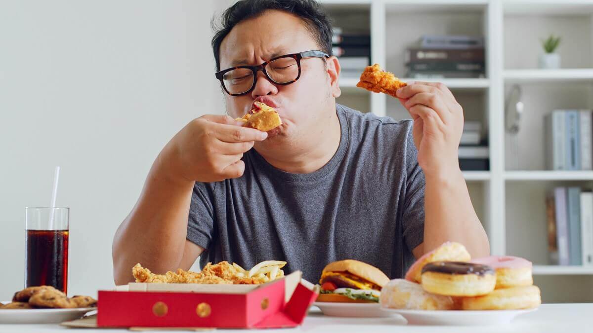 Man eating junk food
