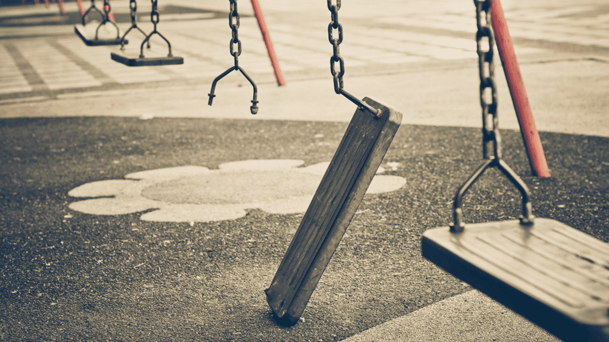 Broken chain swing in playground