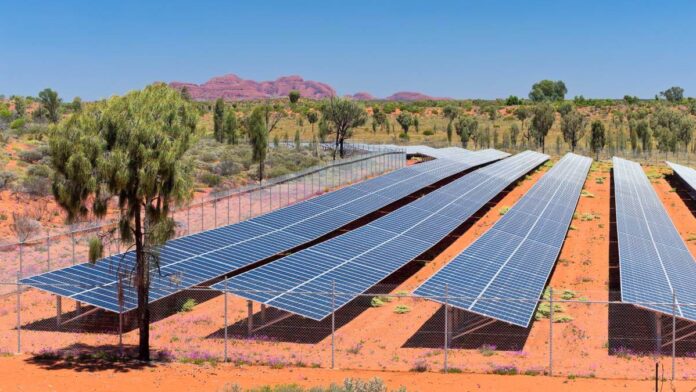 a bank of solar panels in the outback