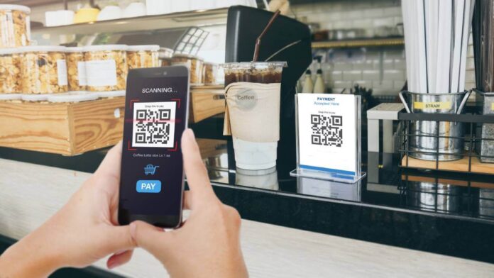 A customer using a QR code at a cafe