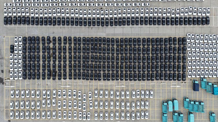 Aerial view of hundreds of electric vehicles.