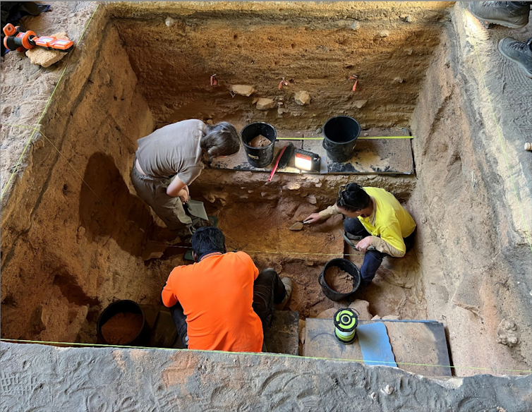 People in a deep square hole.