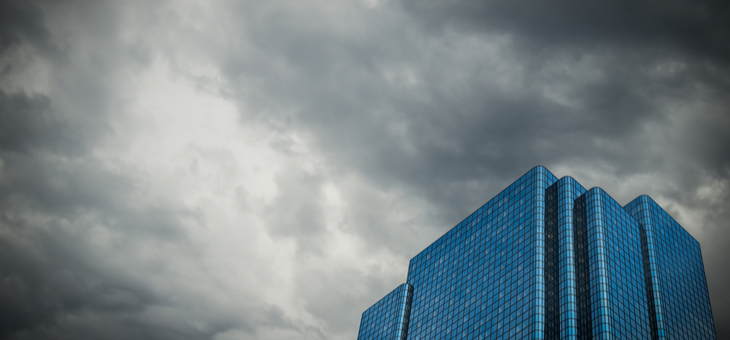Image Of A Financial Building Set Against A Stormy Sky