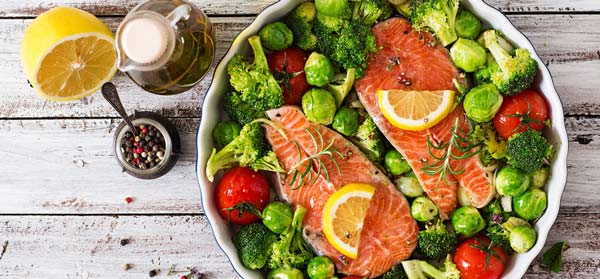 Baked salmon and broccoli in dish  for healthy joints