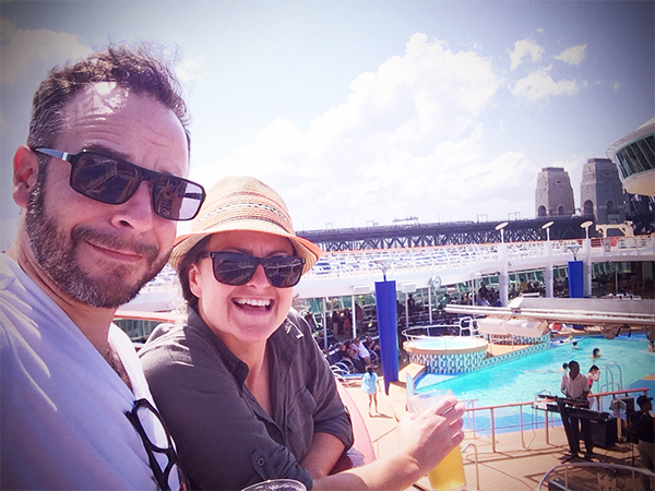 couple-standing-on-the-pool-deck-of-the-explorer-of-the-seas-cruise-ship