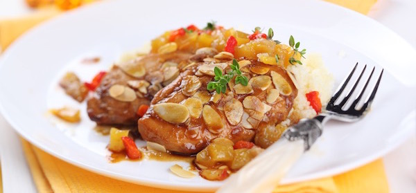 Delicious plate of apricot chicken breasts with toasted almonds