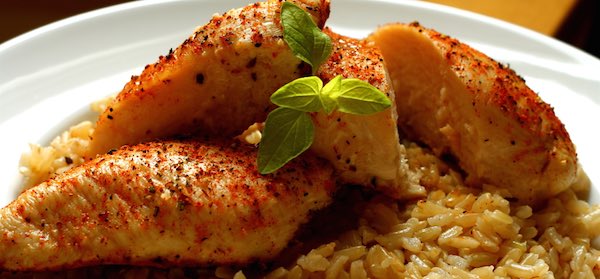 Delicious plate of spiced cajun chicken over rice