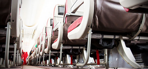 The secret button on your plane seat that will give you more room