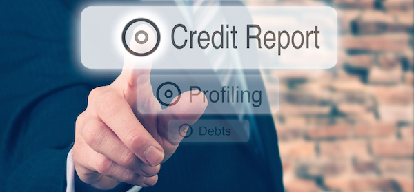 man in business suit pointing his finger to a credit report graphic