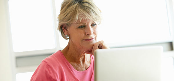 Mature woman using computer