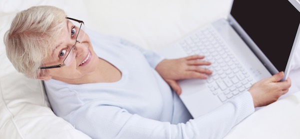 Mature smiling woman with great computer skills