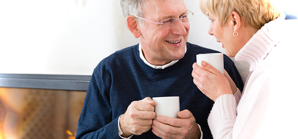 happy older couple drinking coffee