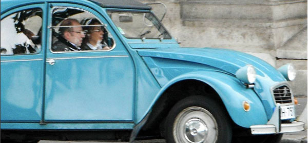 Older couple in France driving blue Citon