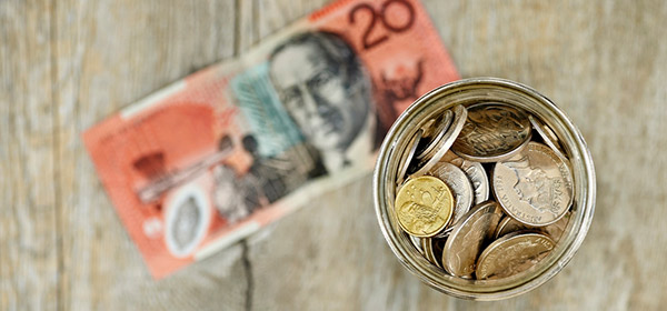 Pension concept Australian coins in a jar