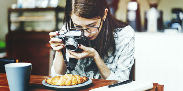 tourist photographing food