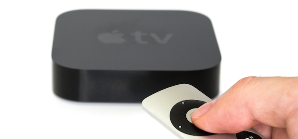 remote control pointing at an apple tv box