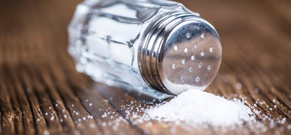 Salt shaker spilled on table