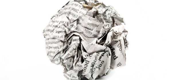 Ball of scrunched up newspaper denoting fake news