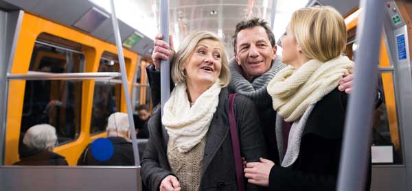 Senior couple travels on public transport with their daughter using concession discounts