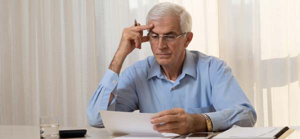 Senior man considers his options for financial assistance can centrelink help