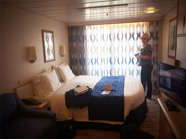 young-lady-standing-in-a-cruise-ship-stateroom